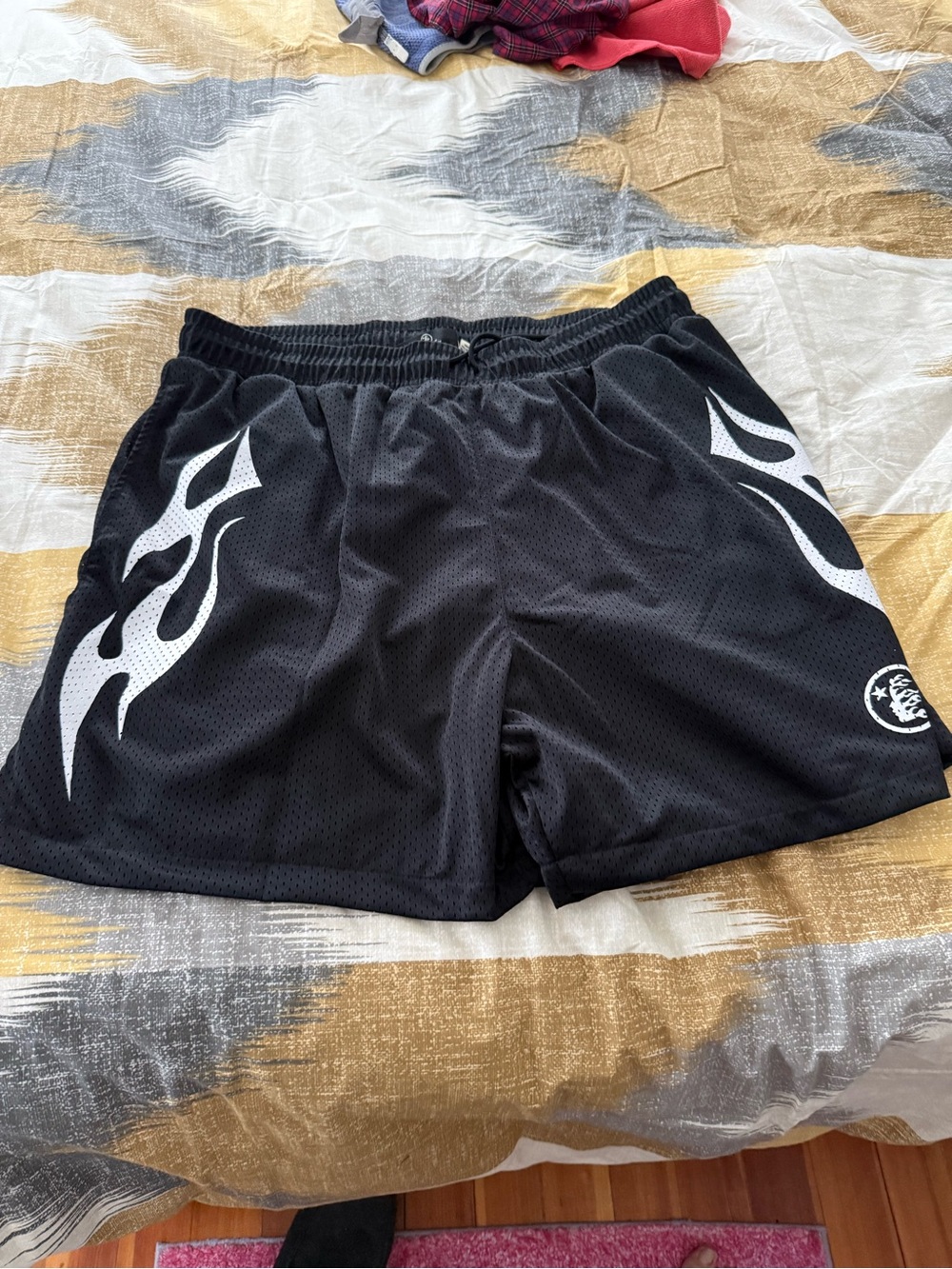 Hellstar Mens Black Athletic Mesh Shorts with White Flame Accent